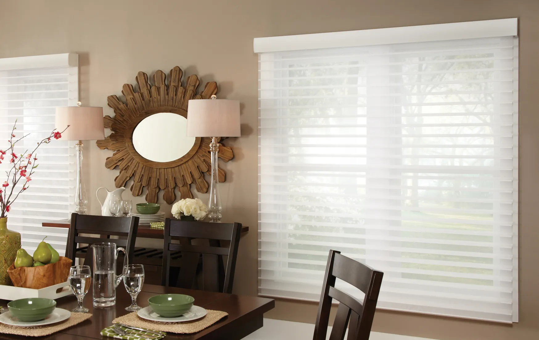 Horizontal sheer blinds filter sunlight while maintaining an outside view in dining room setting.