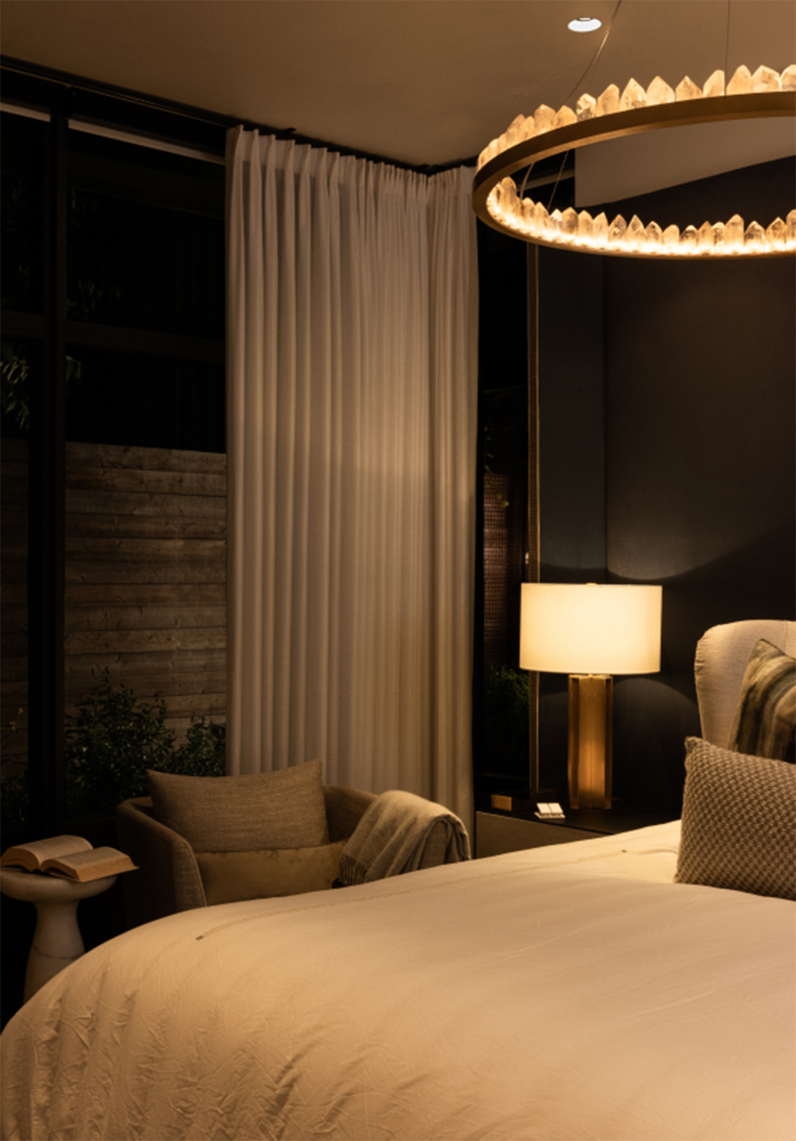 Nighttime bedroom lighting scene featuring drapes and decorative lighting at Stay Bungalow