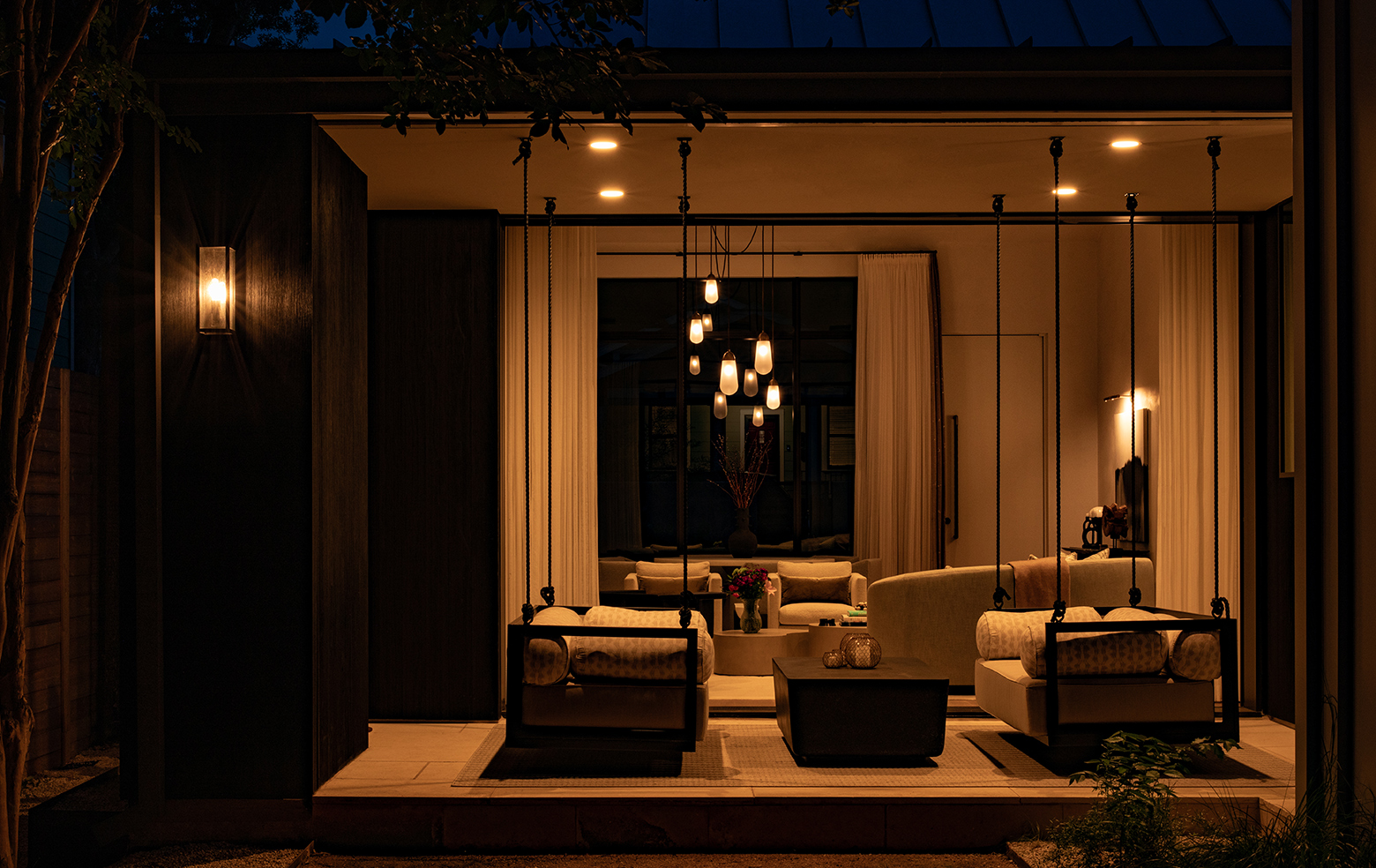 Outdoor decorative lighting over a seating area at night