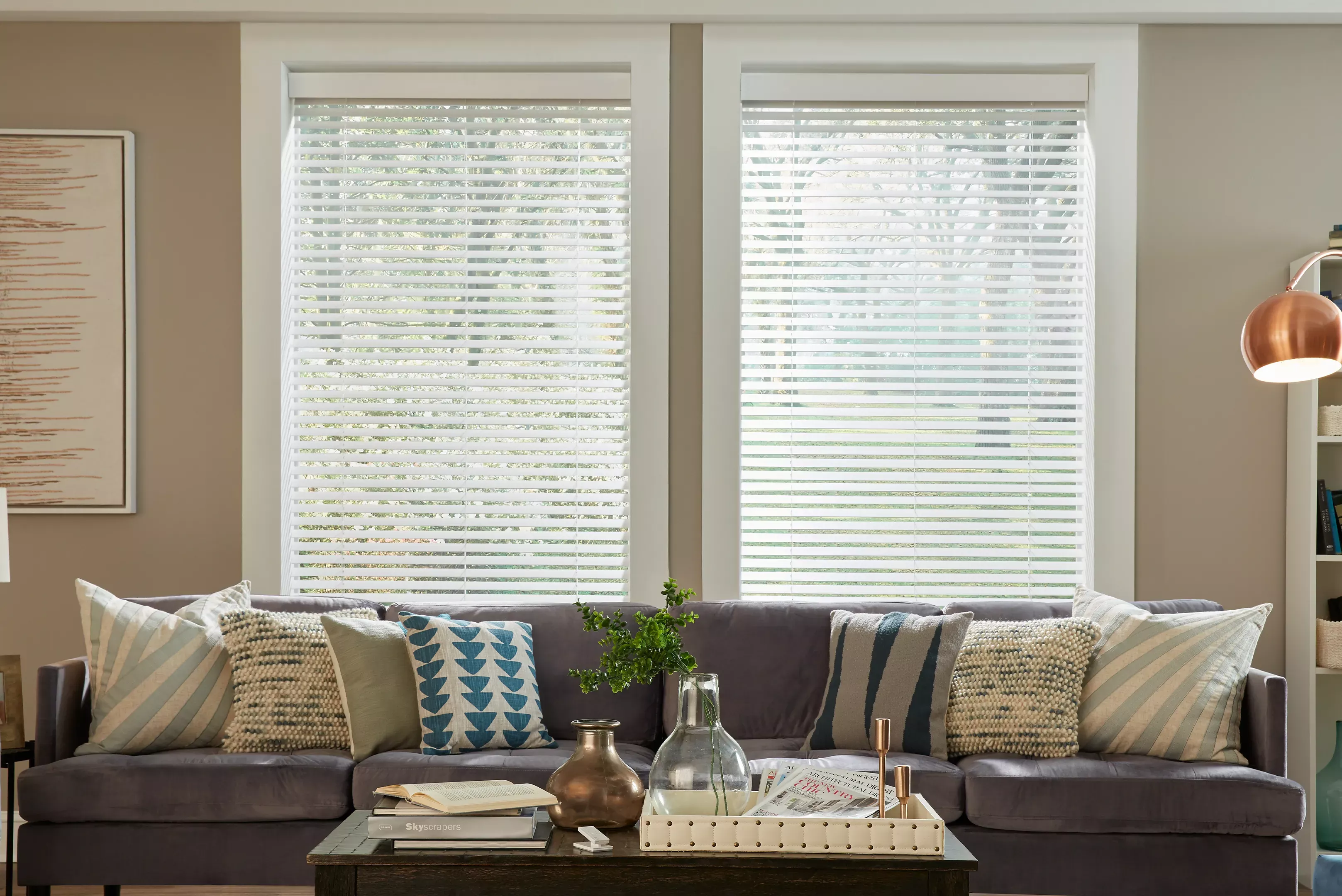 Wood blinds with intelligent tilt alignment balance views and privacy in living room
