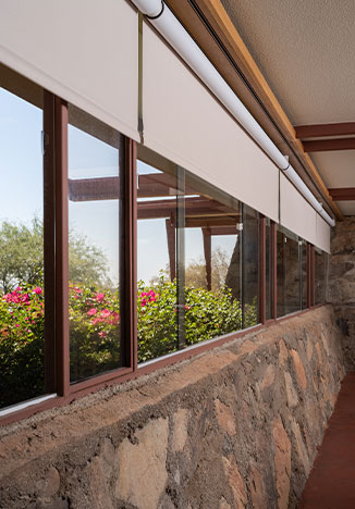 Open Palladiom Roller shades at Frank Lloyd Wright's Taliesin West tucked into the same window alcoves as the original shades.