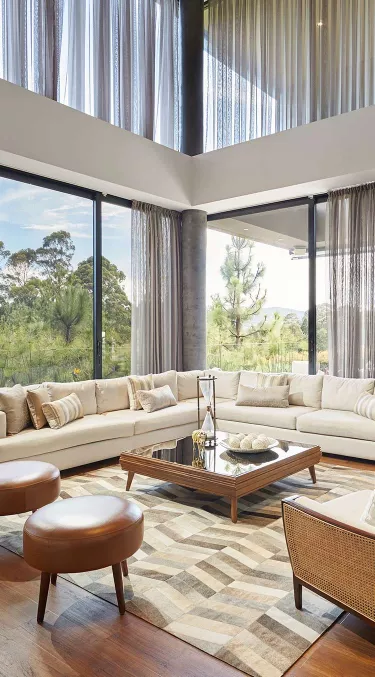 Custom drapes with light filtering fabrics in living room setting
