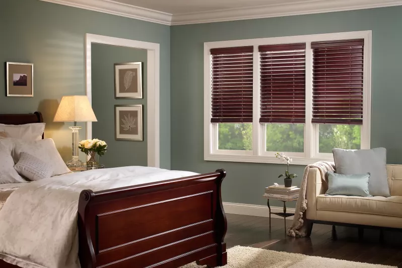 Wood blinds providing privacy in bedroom