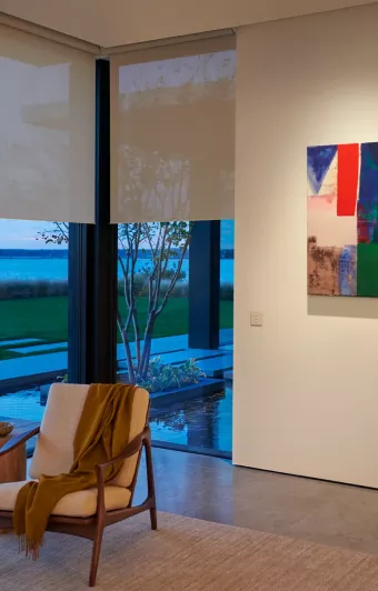 Automated roller shades with open weave enabling view preservation at dusk
