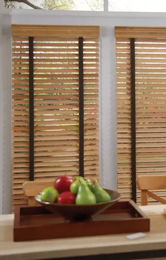Automated wood blinds offering privacy in kitchen